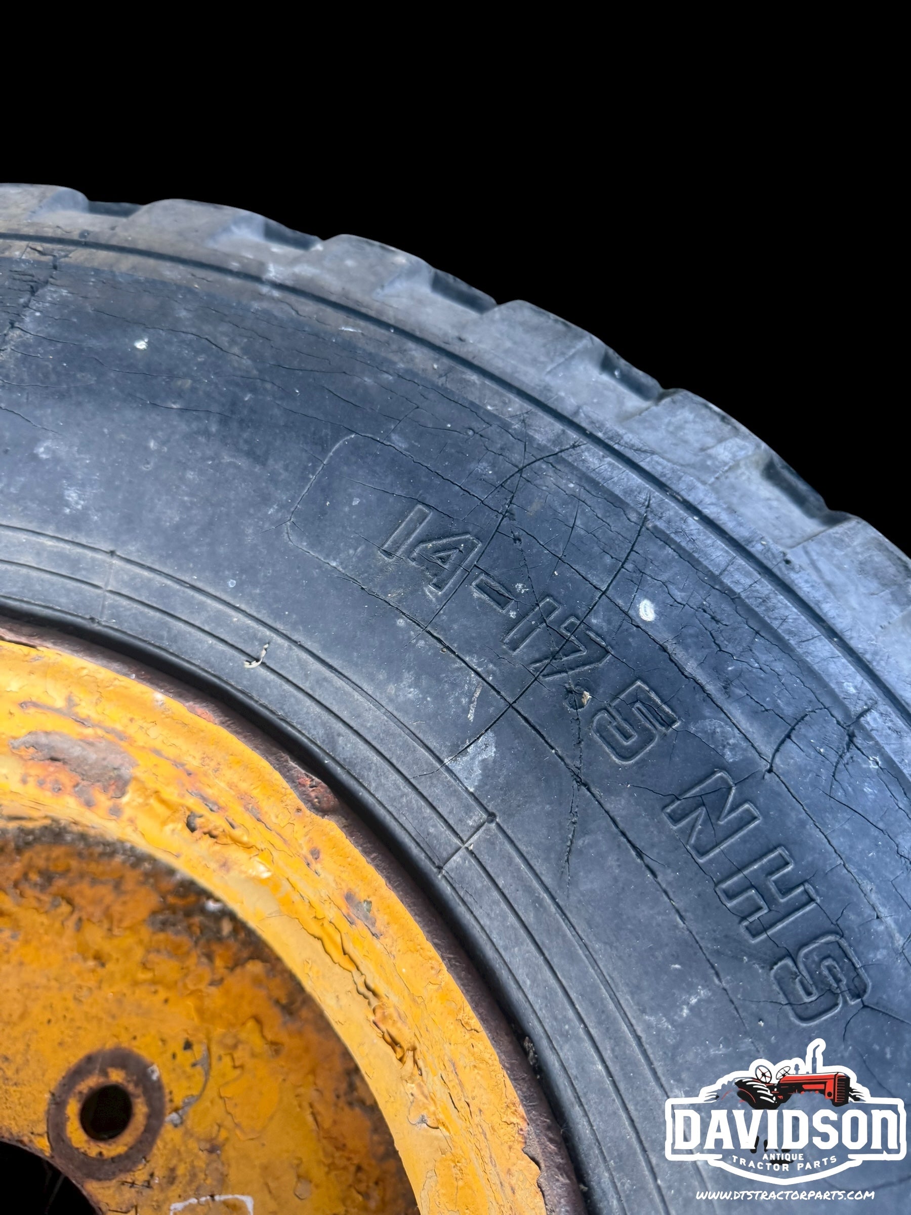 John Deere 500 C backhoe front rim w/tire 14-17.5