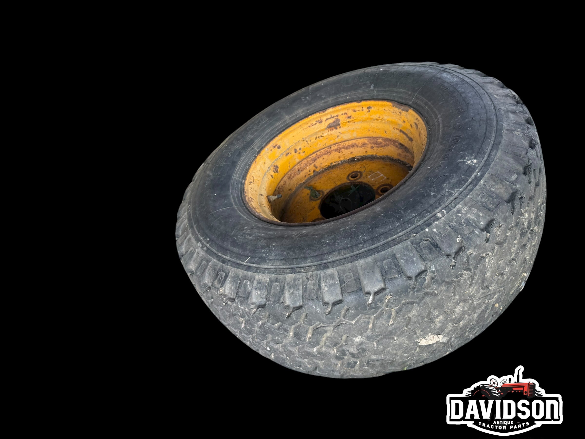 John Deere 500 C backhoe front rim w/tire 14-17.5